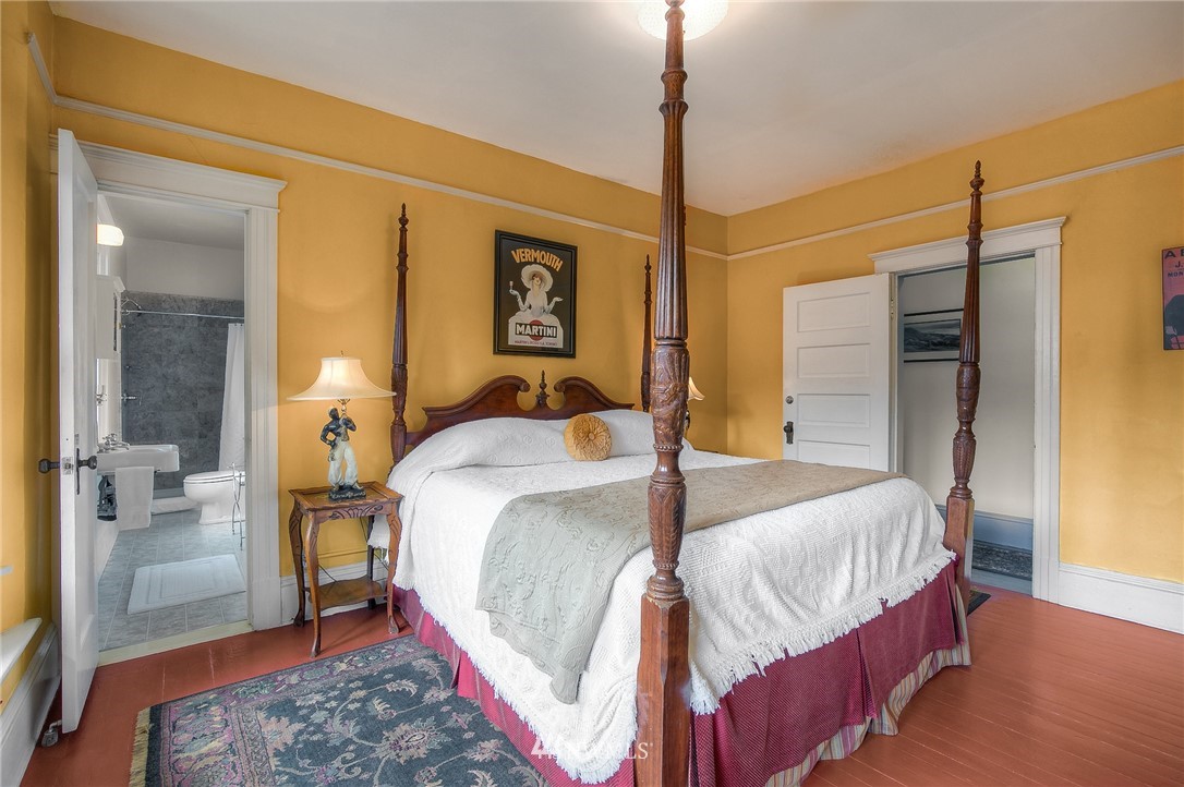 529 19th Avenue Seattle, WA 98122 - Photo 24 of 39 a bedroom with a bed and wooden floor