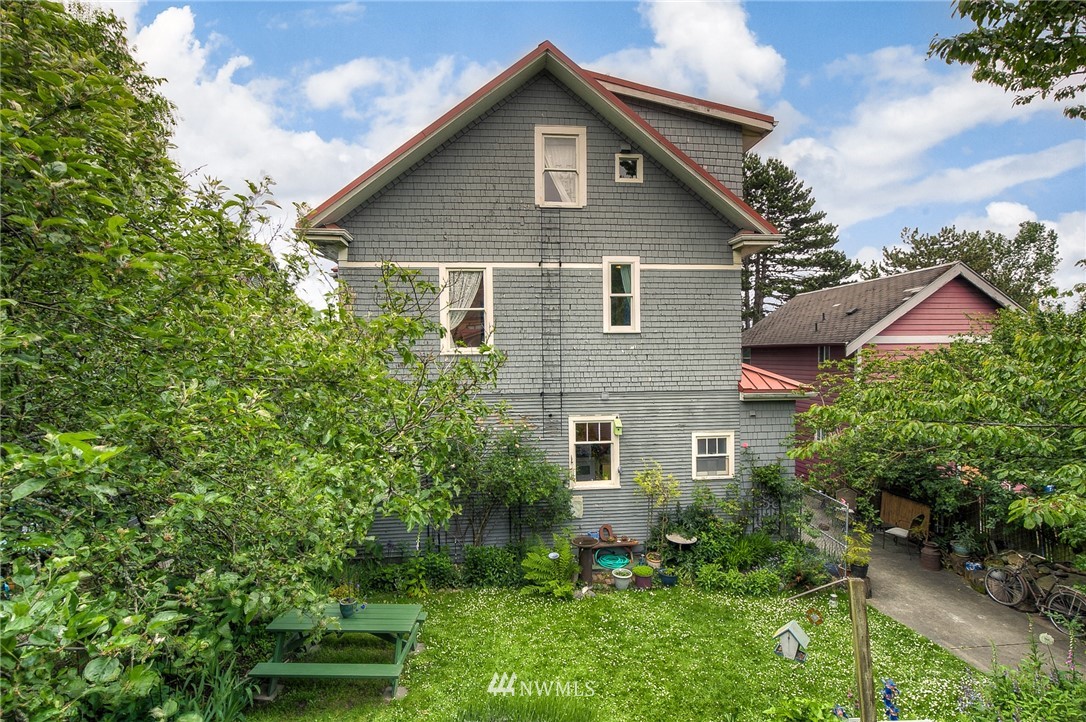 529 19th Avenue Seattle, WA 98122 - Photo 39 of 39 a front view of a house with a yard and trees
