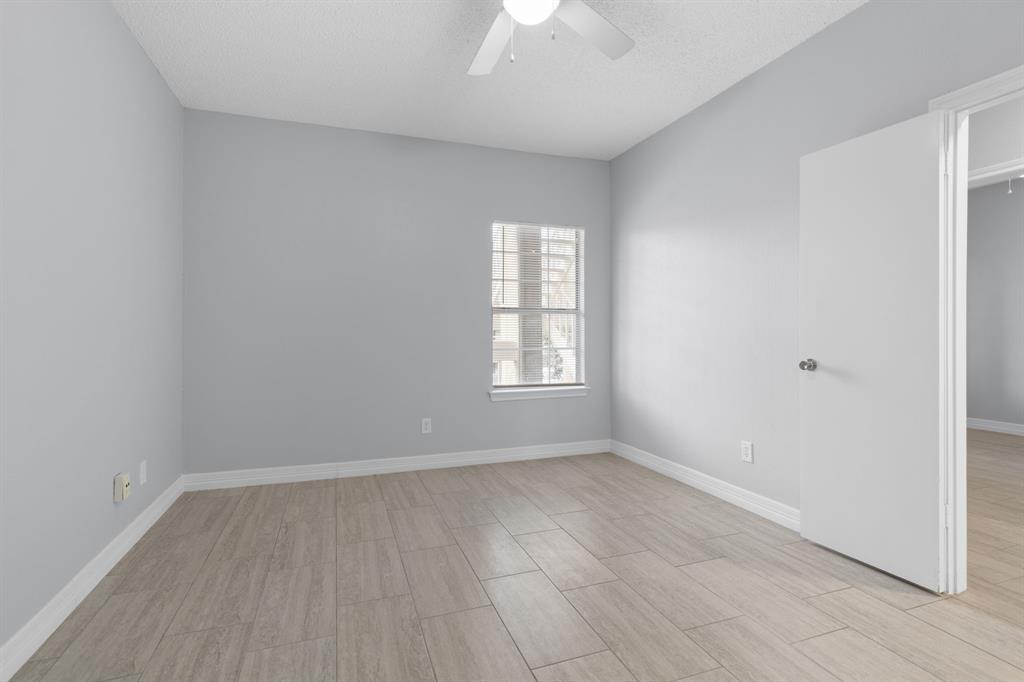 5310 Keller Springs Road, Unit 626 Dallas, TX 75248 - Photo 8 of 13 an empty room with a window