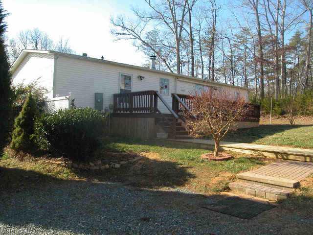 3315 South Friendship Road Germanton, NC 27019 - Photo 2 of 9 Other. Back showing large rear deck, brick walk & board walk to deck