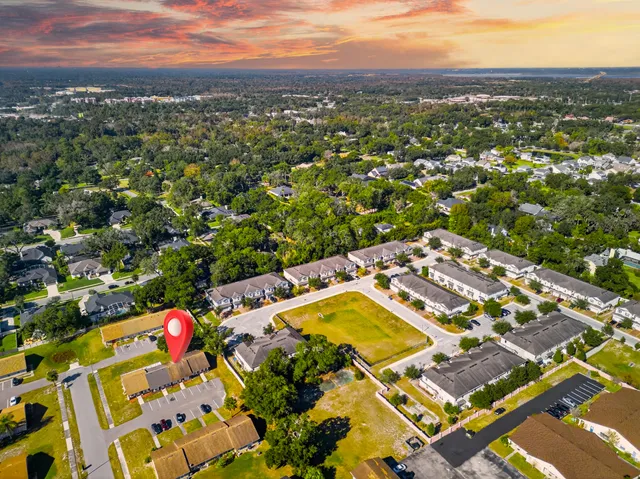 an aerial view of residential houses with outdoor space