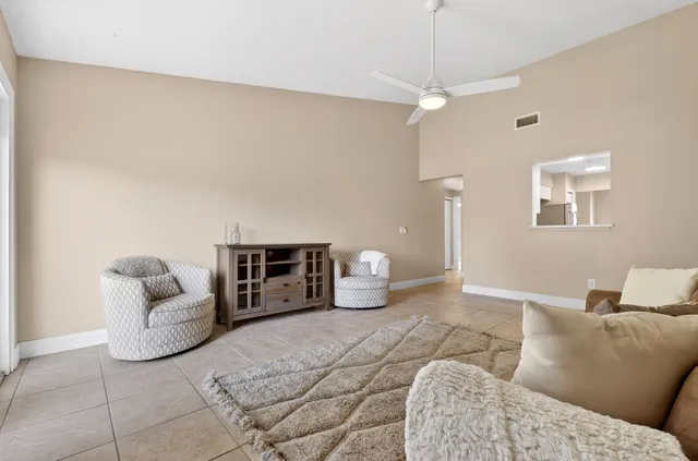 a living room with furniture and a granite counter tops