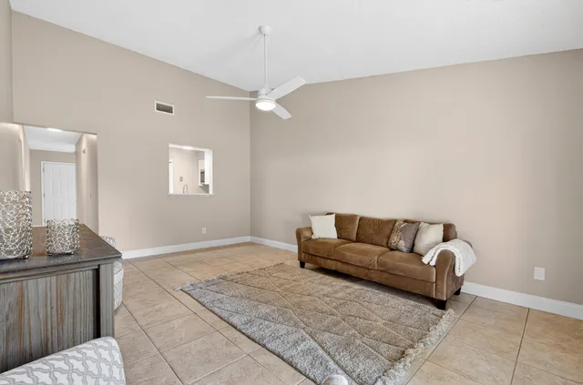 a living room with furniture and a rug