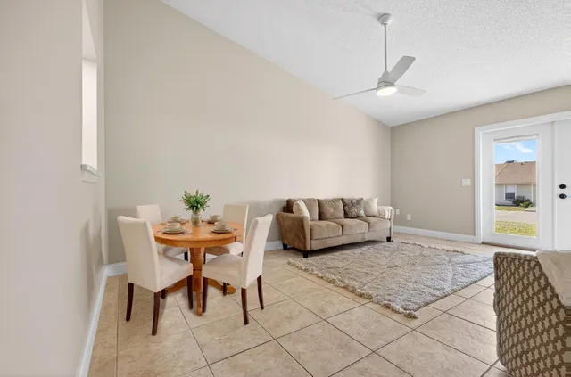 a living room with furniture and a table