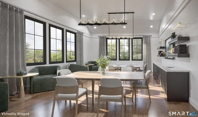 a view of a dining room with furniture window and wooden floor