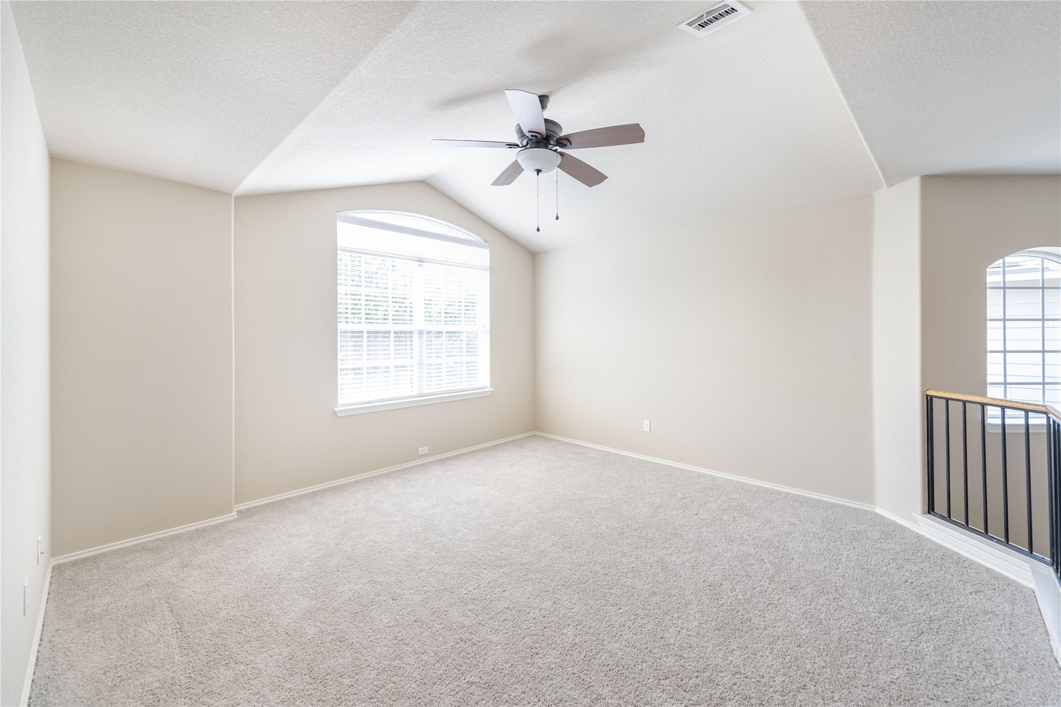 11221 Old Quarry Road Austin, TX 78717 - Photo 9 of 19 Vaulted ceilings and soft wall-to-wall carpeting define this airy second-level bonus space.