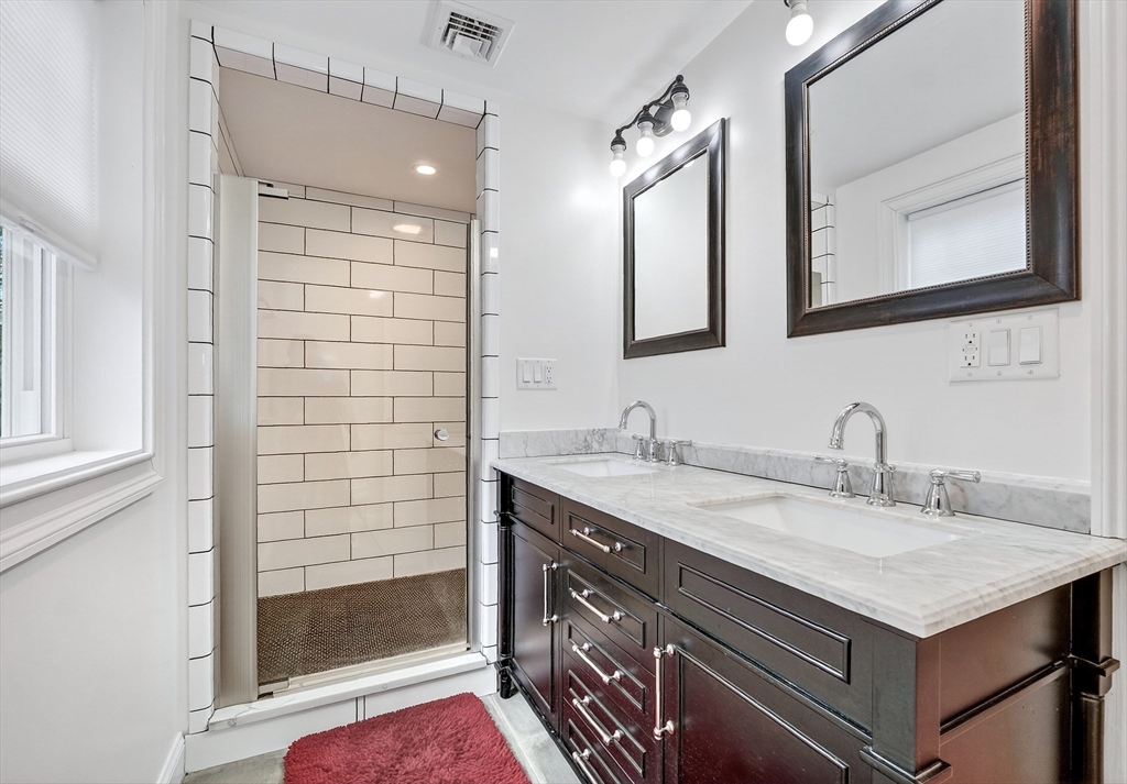 87 Payson Road Brookline, MA 02467 - Photo 25 of 41 a bathroom with a sink and a mirror