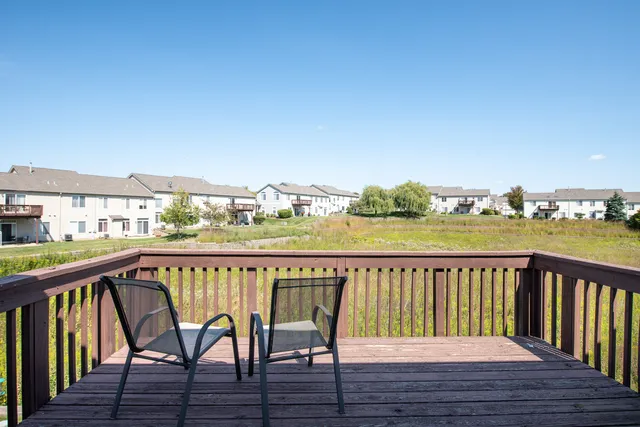 a view of a chairs on the roof deck