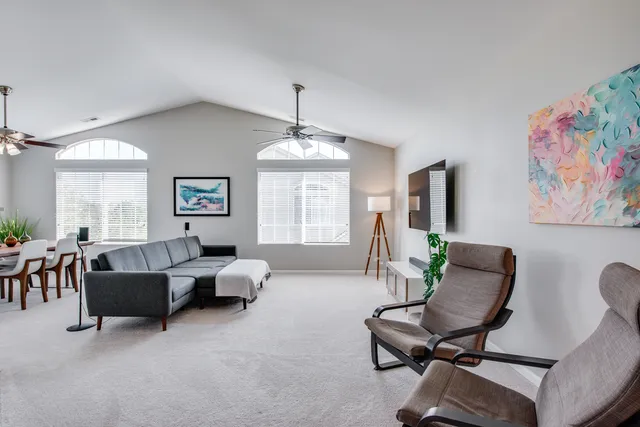 a living room with furniture and a window