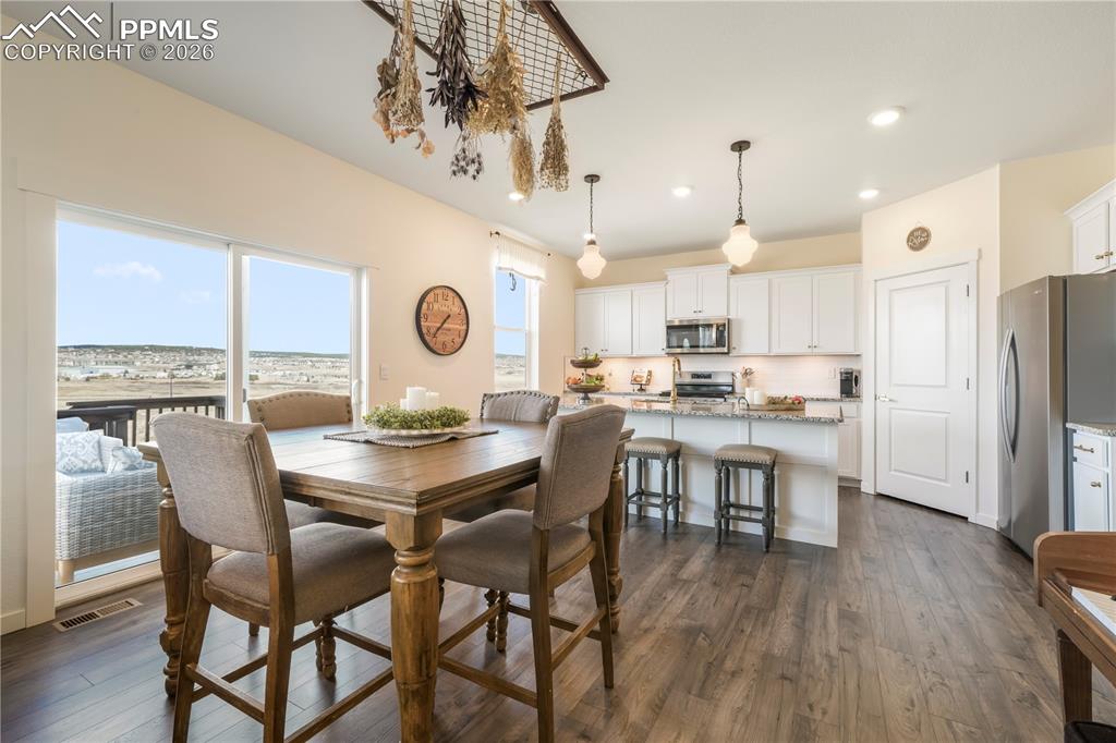 15882 Little Bluestem Road Monument, CO 80132 - Photo 16 of 50 Dining area with access to the back patio