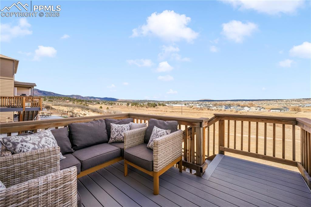 15882 Little Bluestem Road Monument, CO 80132 - Photo 17 of 50 Composite deck with access from dining area and stairs to back yard