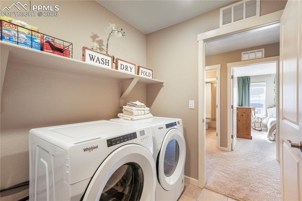 15882 Little Bluestem Road Monument, CO 80132 - Photo 33 of 50 Upstairs laundry area with tile floors