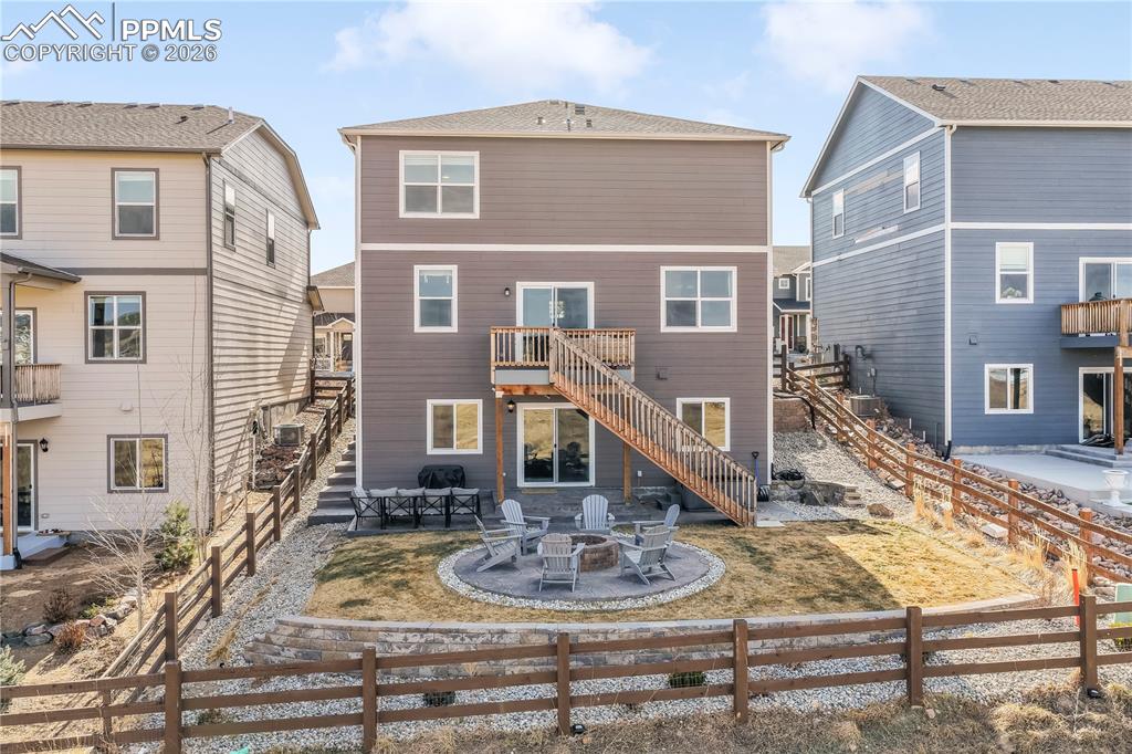 15882 Little Bluestem Road Monument, CO 80132 - Photo 48 of 50 Backyard with gas firepit, fenced yard, tiered stamp concrete patio areas and hot tub