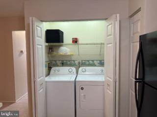 38 Jumpers Circle, Unit 253 Nottingham, MD 21236 - Photo 12 of 31 a utility room with dryer and washer