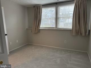 38 Jumpers Circle, Unit 253 Nottingham, MD 21236 - Photo 20 of 31 an empty room with a window