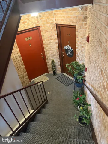 a kitchen with stainless steel appliances a stove refrigerator and microwave