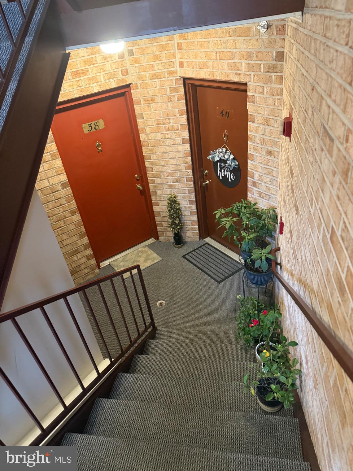 38 Jumpers Circle, Unit 253 Nottingham, MD 21236 - Photo 2 of 31 a front view of a house with a garden