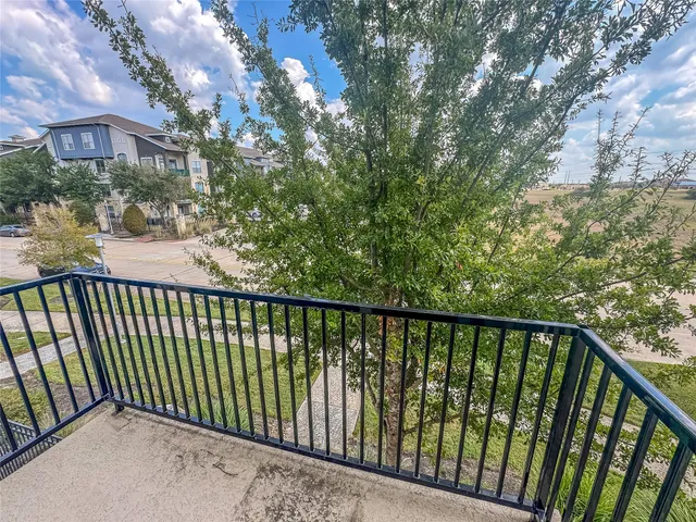 a view of a balcony with a pot