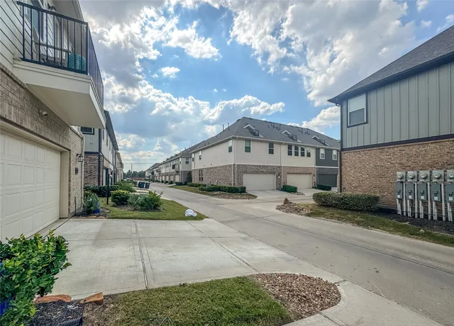 a view of a house next to a yard