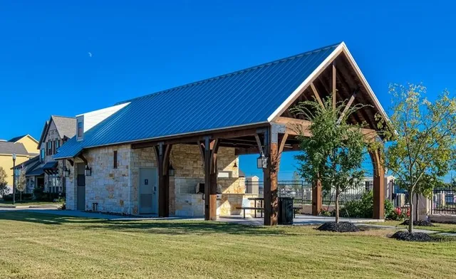 a view of a house with swimming pool and porch