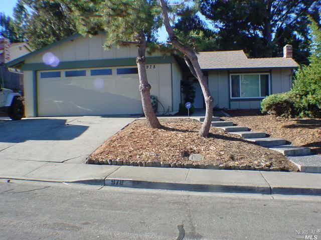 978 Baypoint Way Rodeo, CA 94572 - Photo 1 of 1 a view of a wooden house with a yard and large tree