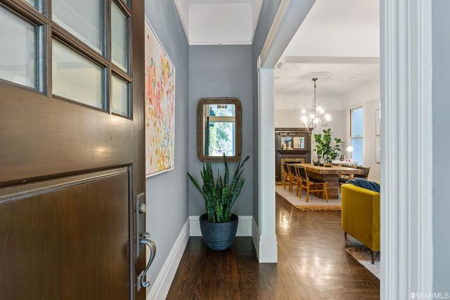 a living room with furniture rug and window