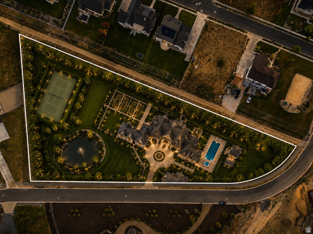 574 South Fox Den Road, Unit 3 Midway, UT 84049 - Photo 4 of 45 Example of what could be built: Expansive estate featuring a central residence, a tennis court, a swimming pool, a circular driveway, and a large ornamental pond with a fountain