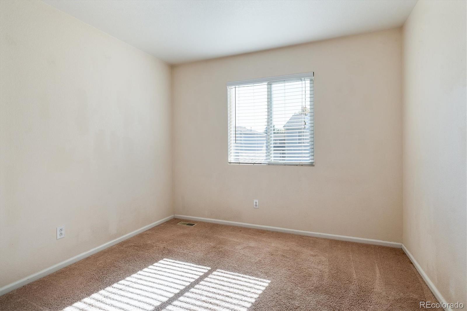 1345 Trail Ridge Road Longmont, CO 80504 - Photo 17 of 25 an empty room with a window