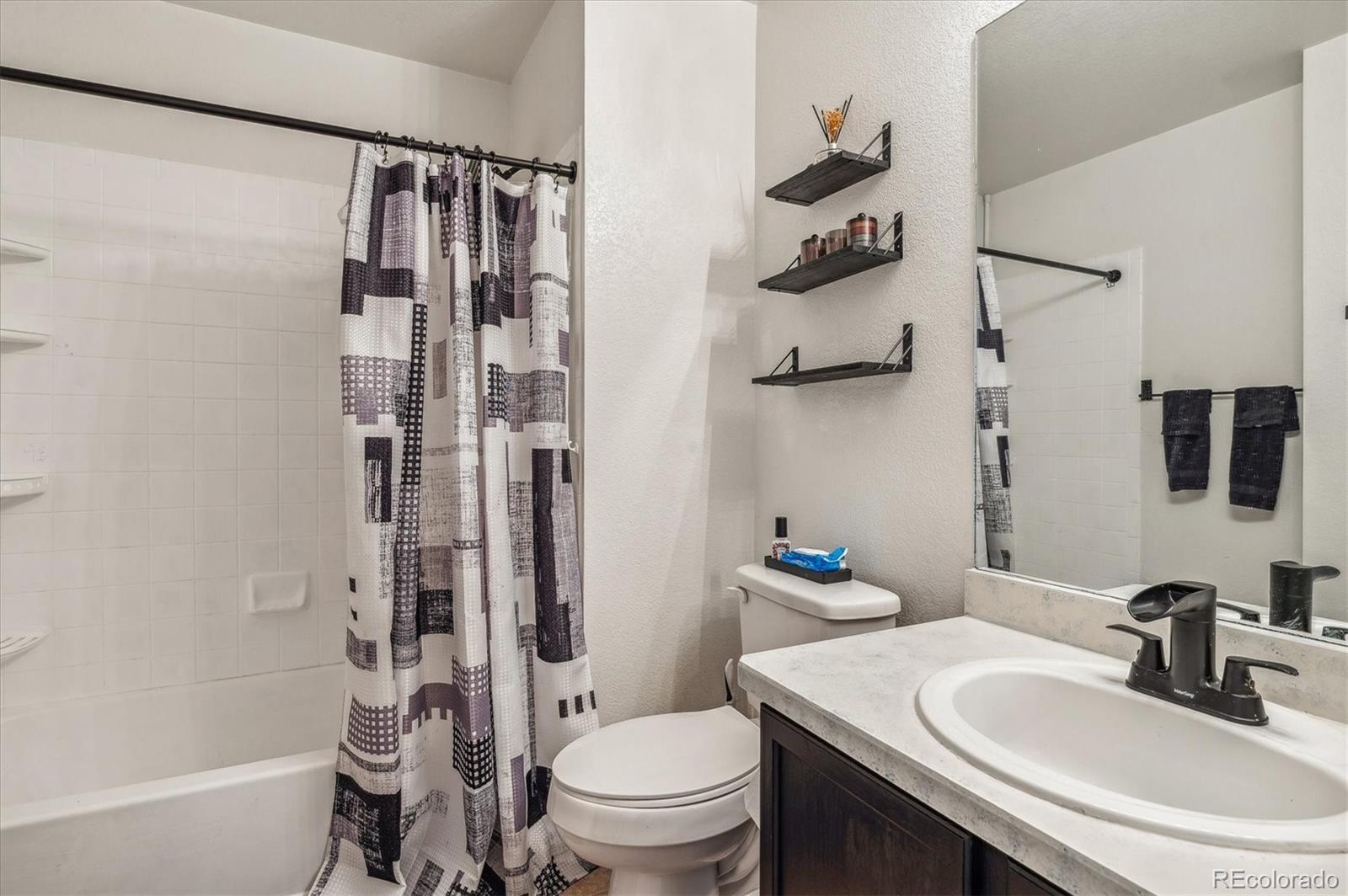 1345 Trail Ridge Road Longmont, CO 80504 - Photo 18 of 25 a bathroom with a sink toilet tub and shower