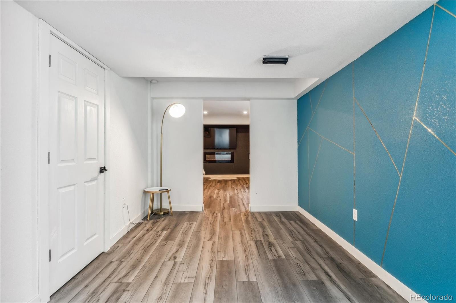 1345 Trail Ridge Road Longmont, CO 80504 - Photo 22 of 25 a view of a room with wooden floor