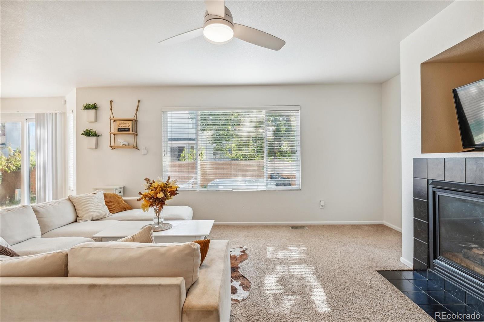 1345 Trail Ridge Road Longmont, CO 80504 - Photo 10 of 25 a living room with furniture and a fireplace