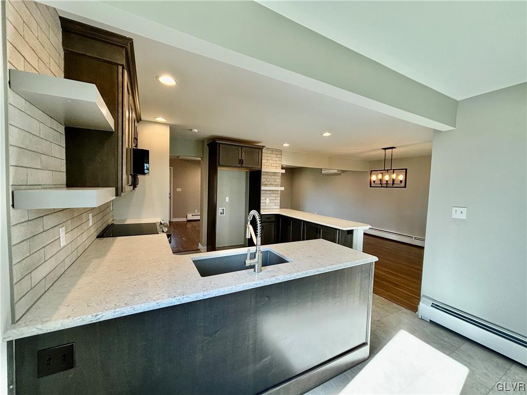 3172 Shakespeare Road Bethlehem, PA 18017 - Photo 7 of 19 a large kitchen with a large counter top stainless steel appliances and cabinets
