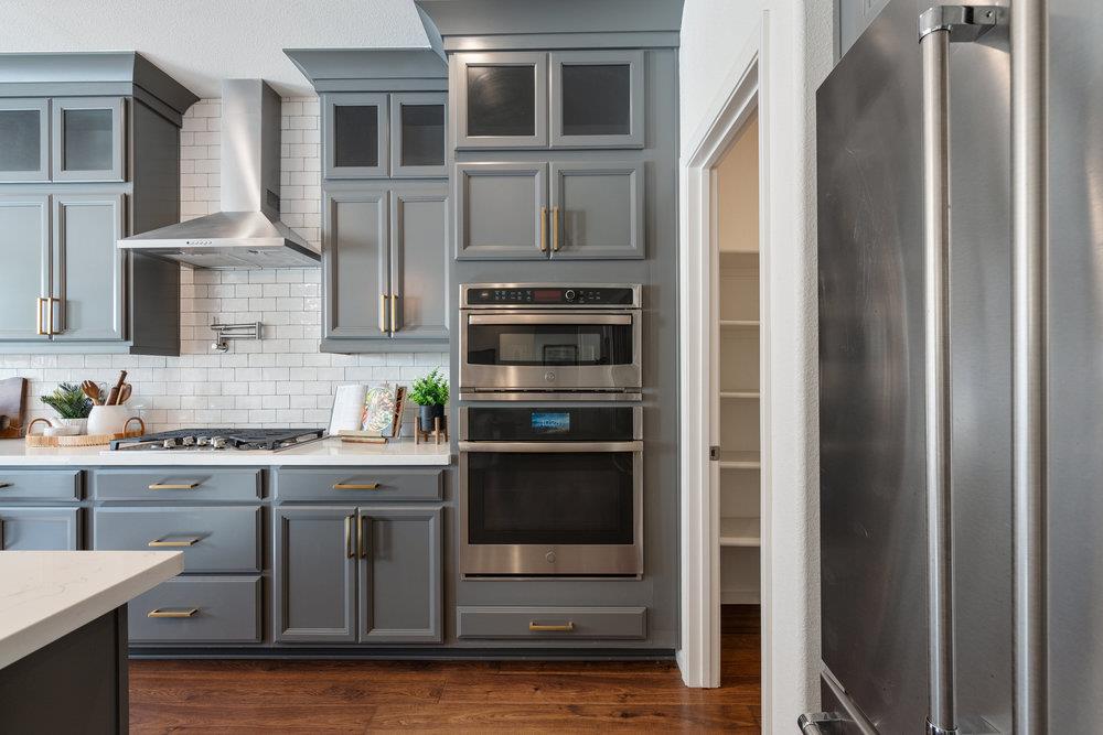 20 Hospital Road Hollister, CA 95023 - Photo 16 of 46 a kitchen with stainless steel appliances granite countertop a stove and a refrigerator