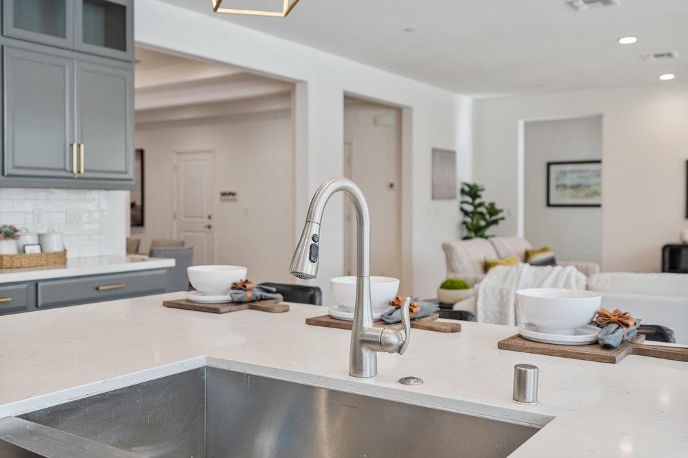 20 Hospital Road Hollister, CA 95023 - Photo 18 of 46 a kitchen with a sink and a stove top oven