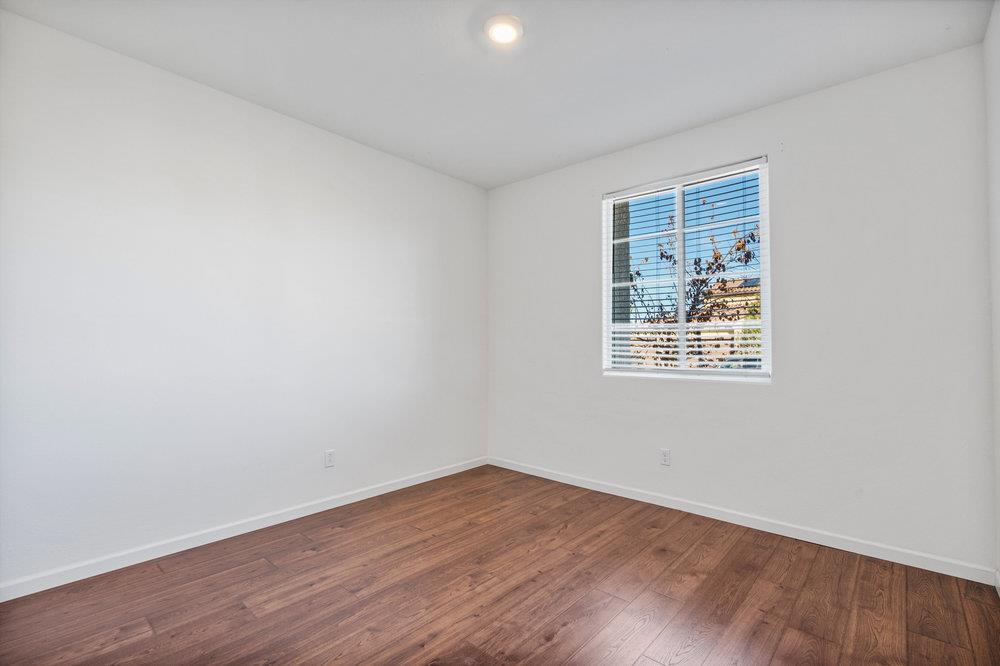 20 Hospital Road Hollister, CA 95023 - Photo 30 of 46 an empty room with wooden floor and windows