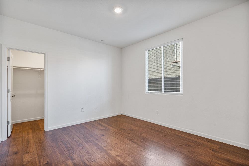20 Hospital Road Hollister, CA 95023 - Photo 33 of 46 an empty room with wooden floor and windows