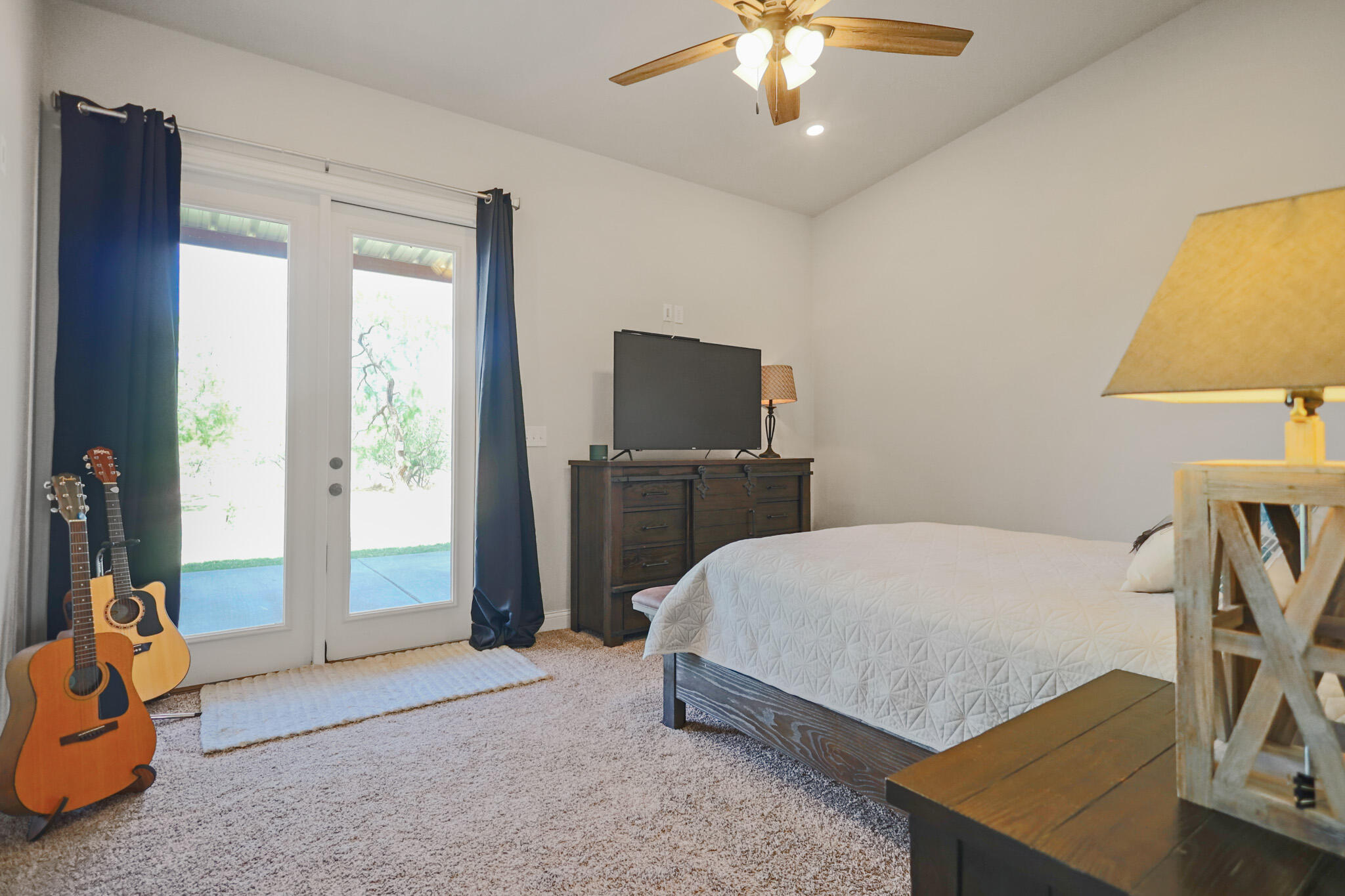 301 Fagan Road Snyder, TX 79549 - Photo 55 of 102 a bedroom with a bed and a tv