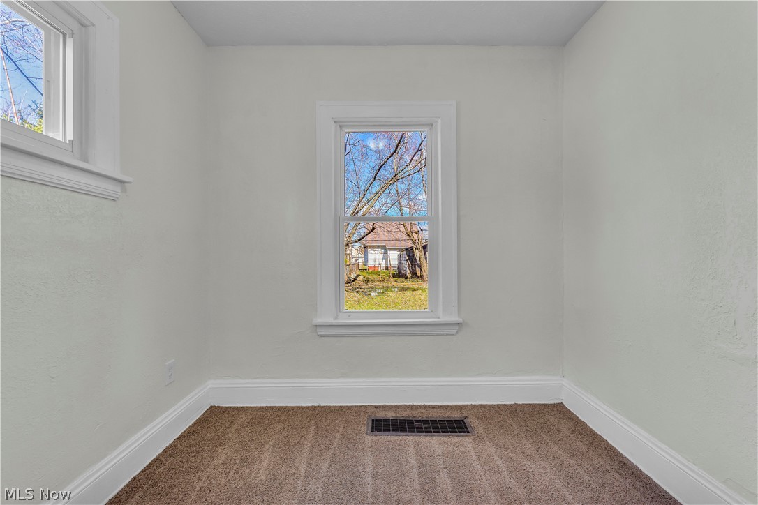 12905 Watterson Avenue Cleveland, OH 44105 - Photo 15 of 30 Unfurnished room featuring carpet floors and a textured wall