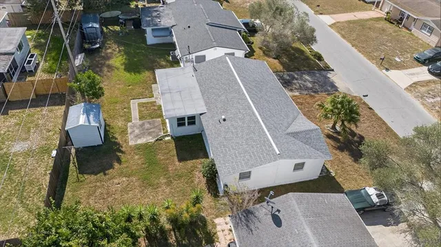 an aerial view of a house with outdoor space
