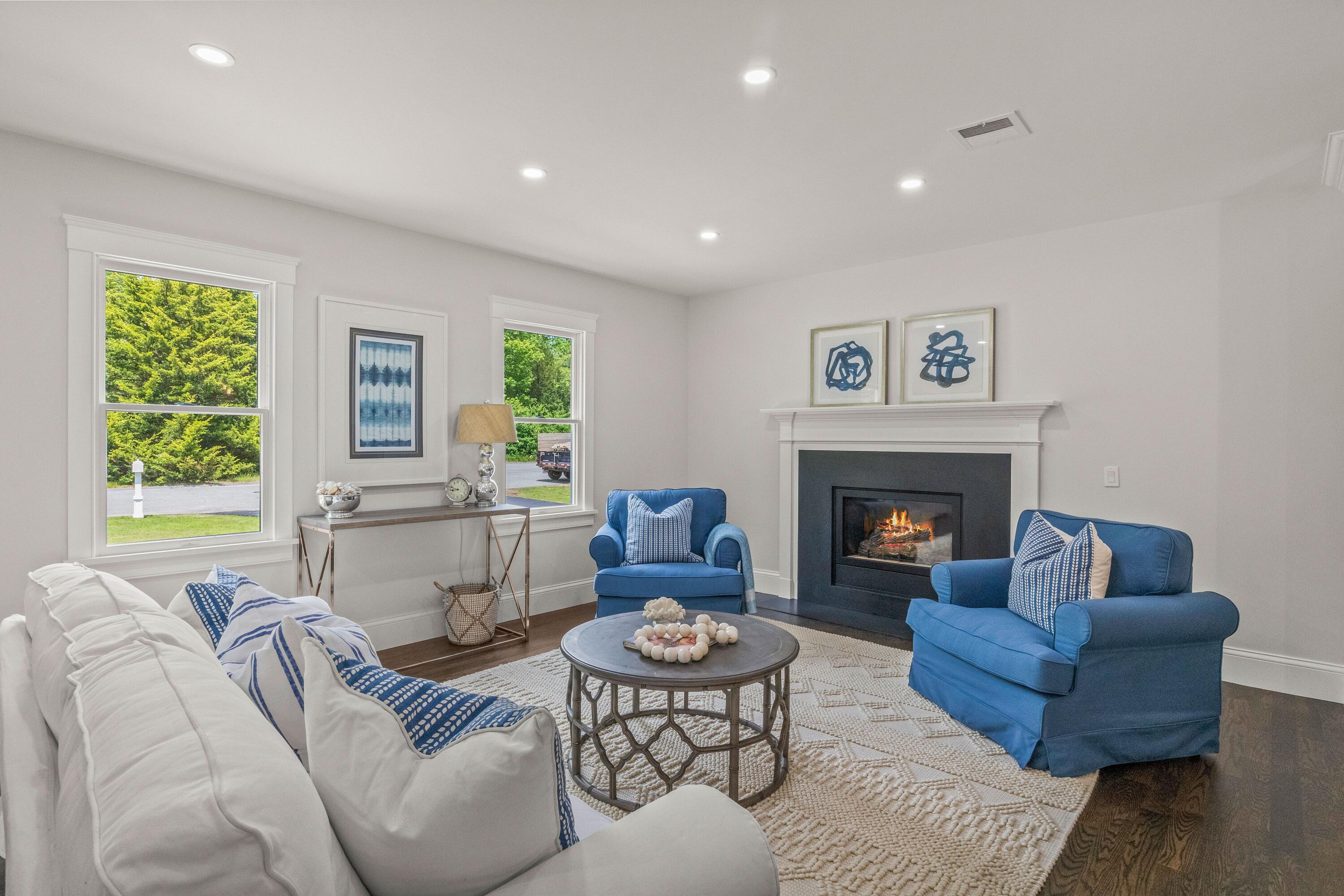 5 Locust Grove Road Harwich, MA 02645 - Photo 11 of 39 a living room with furniture and a fireplace
