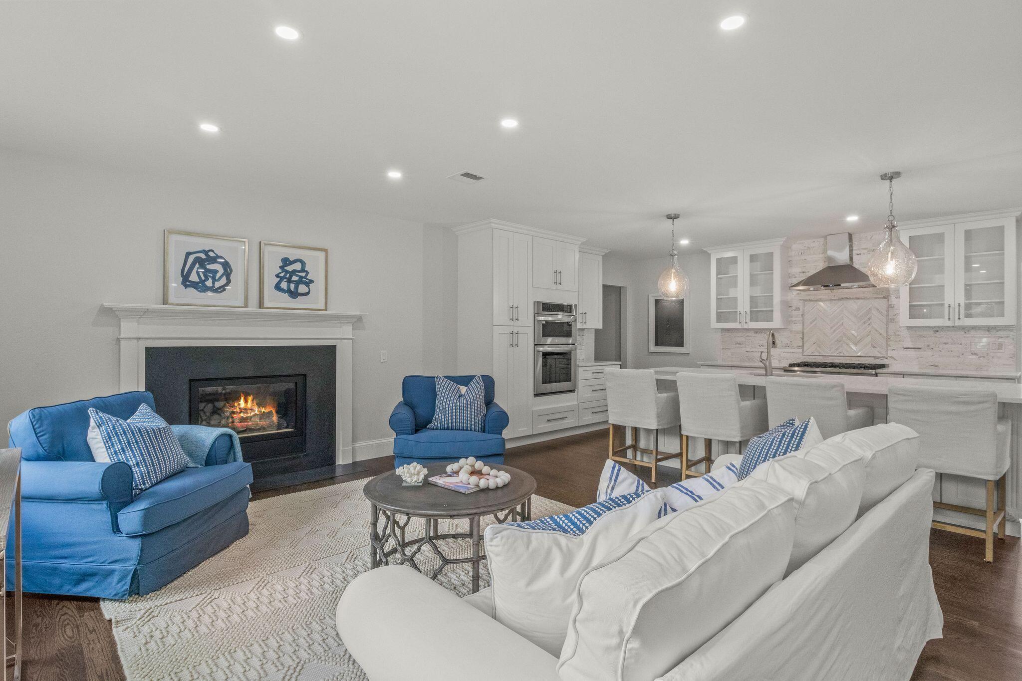 5 Locust Grove Road Harwich, MA 02645 - Photo 13 of 39 a living room with furniture and a fireplace
