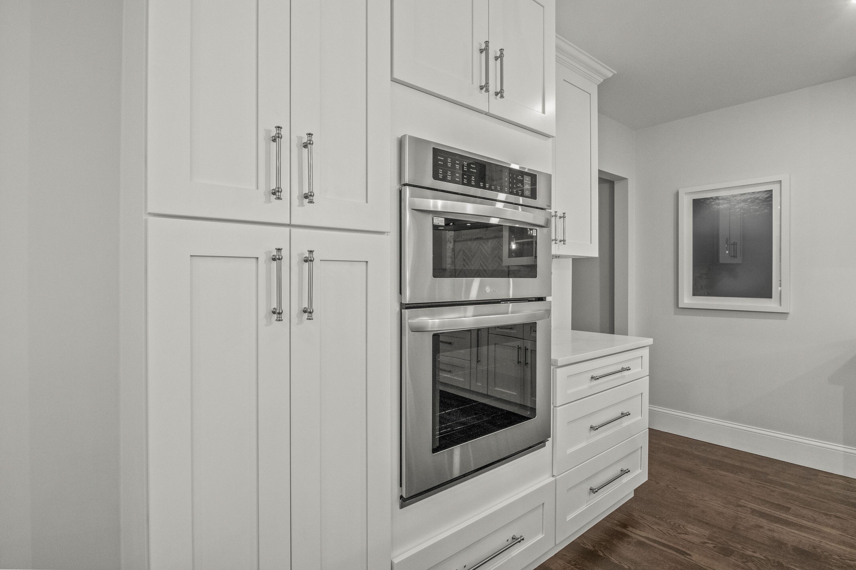 5 Locust Grove Road Harwich, MA 02645 - Photo 15 of 39 a kitchen with stainless steel appliances white cabinets and stove top oven