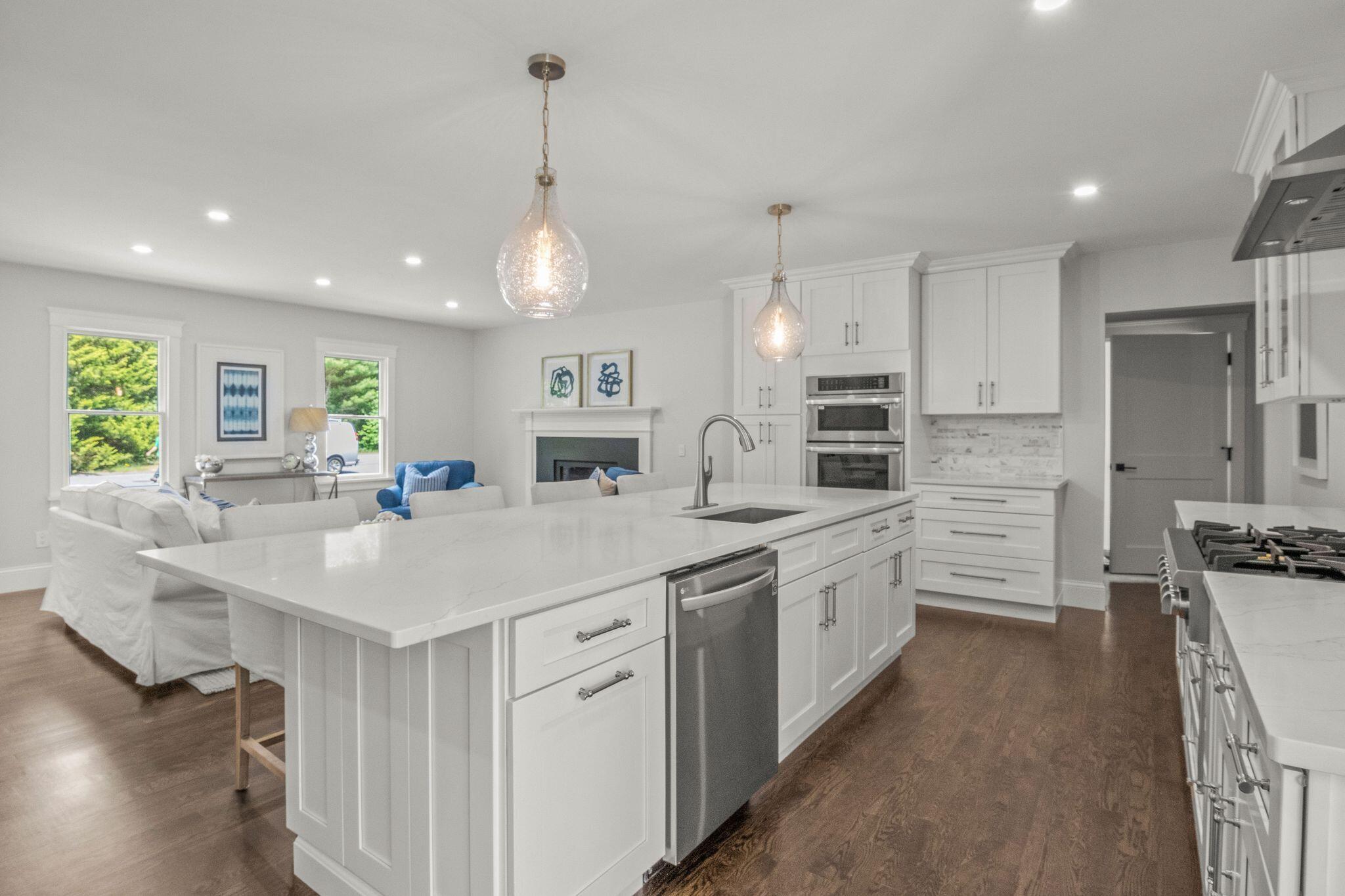 5 Locust Grove Road Harwich, MA 02645 - Photo 17 of 39 a large white kitchen with cabinets a sink and appliances