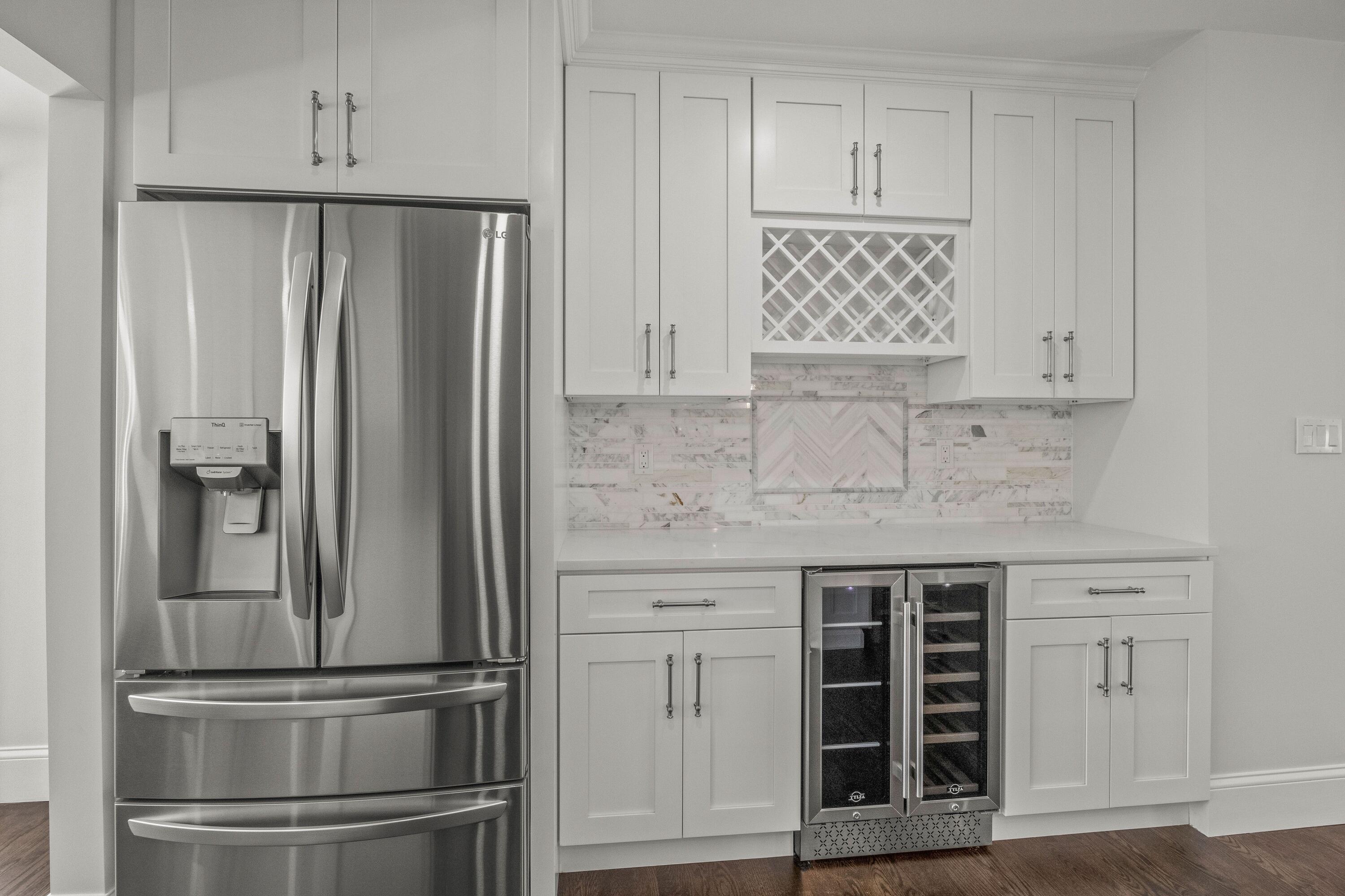 5 Locust Grove Road Harwich, MA 02645 - Photo 19 of 39 a kitchen with granite countertop a refrigerator and cabinets