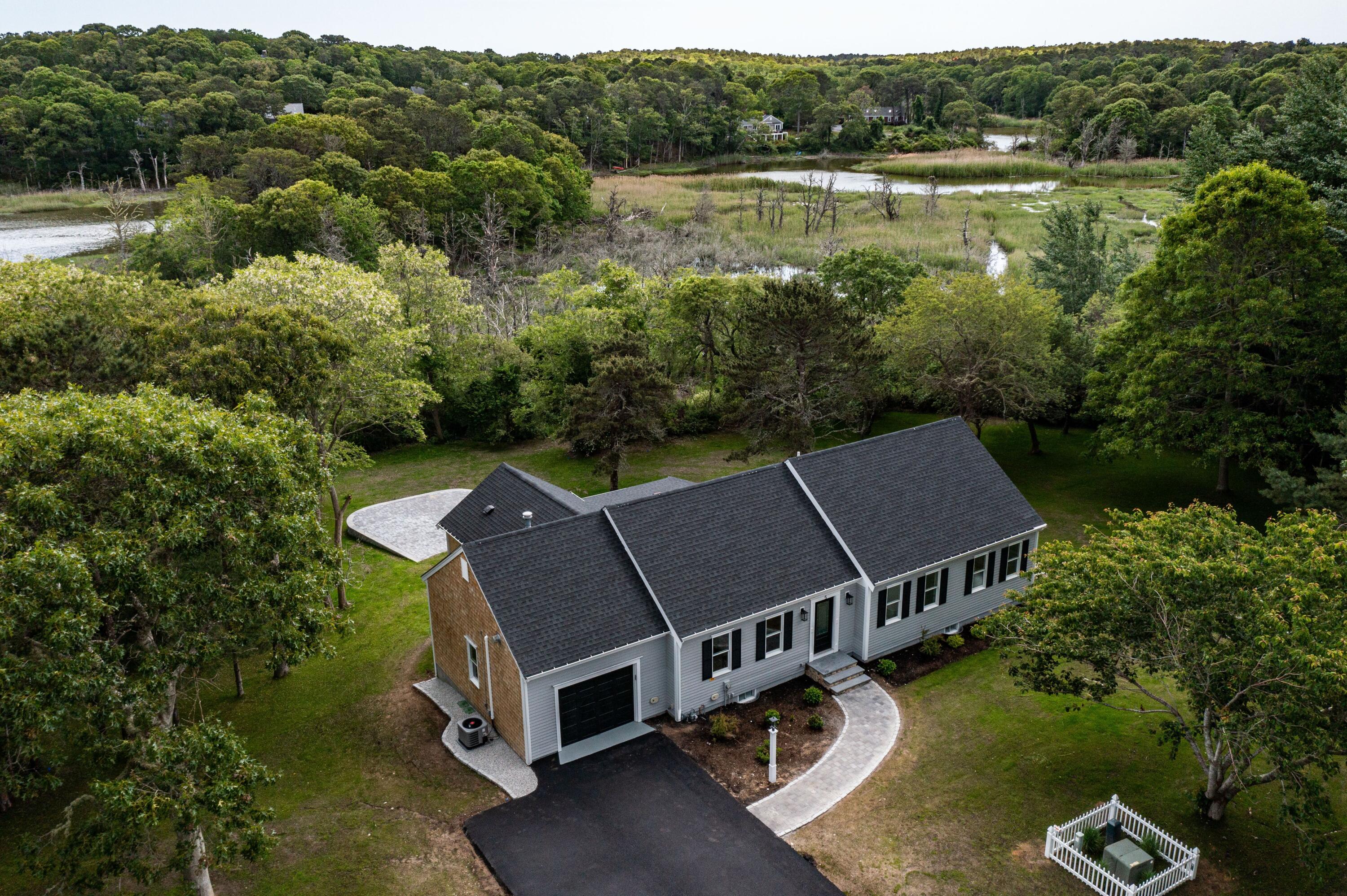 5 Locust Grove Road Harwich, MA 02645 - Photo 2 of 39 an aerial view of a house with pool