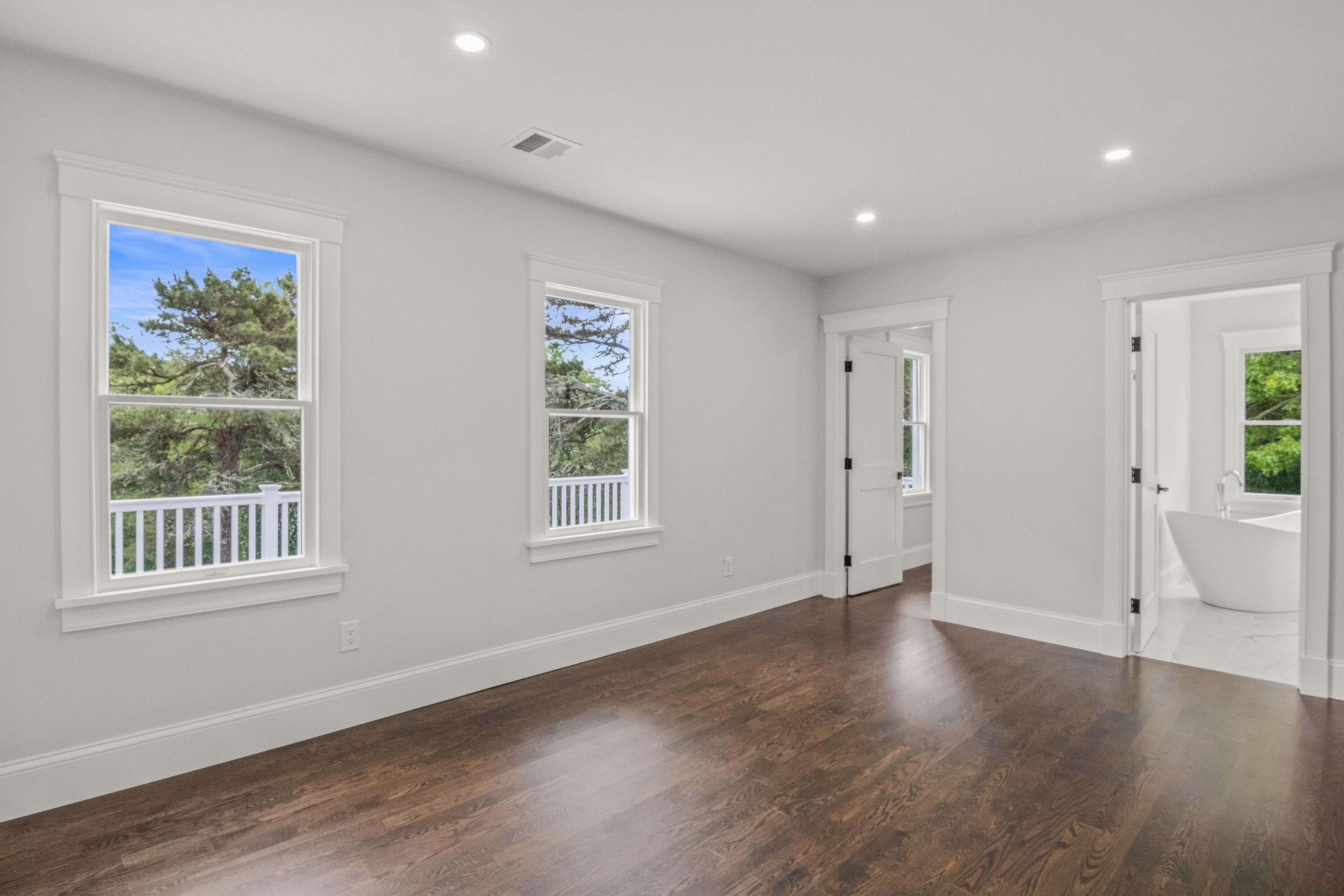 5 Locust Grove Road Harwich, MA 02645 - Photo 23 of 39 a view of an empty room with wooden floor and windows