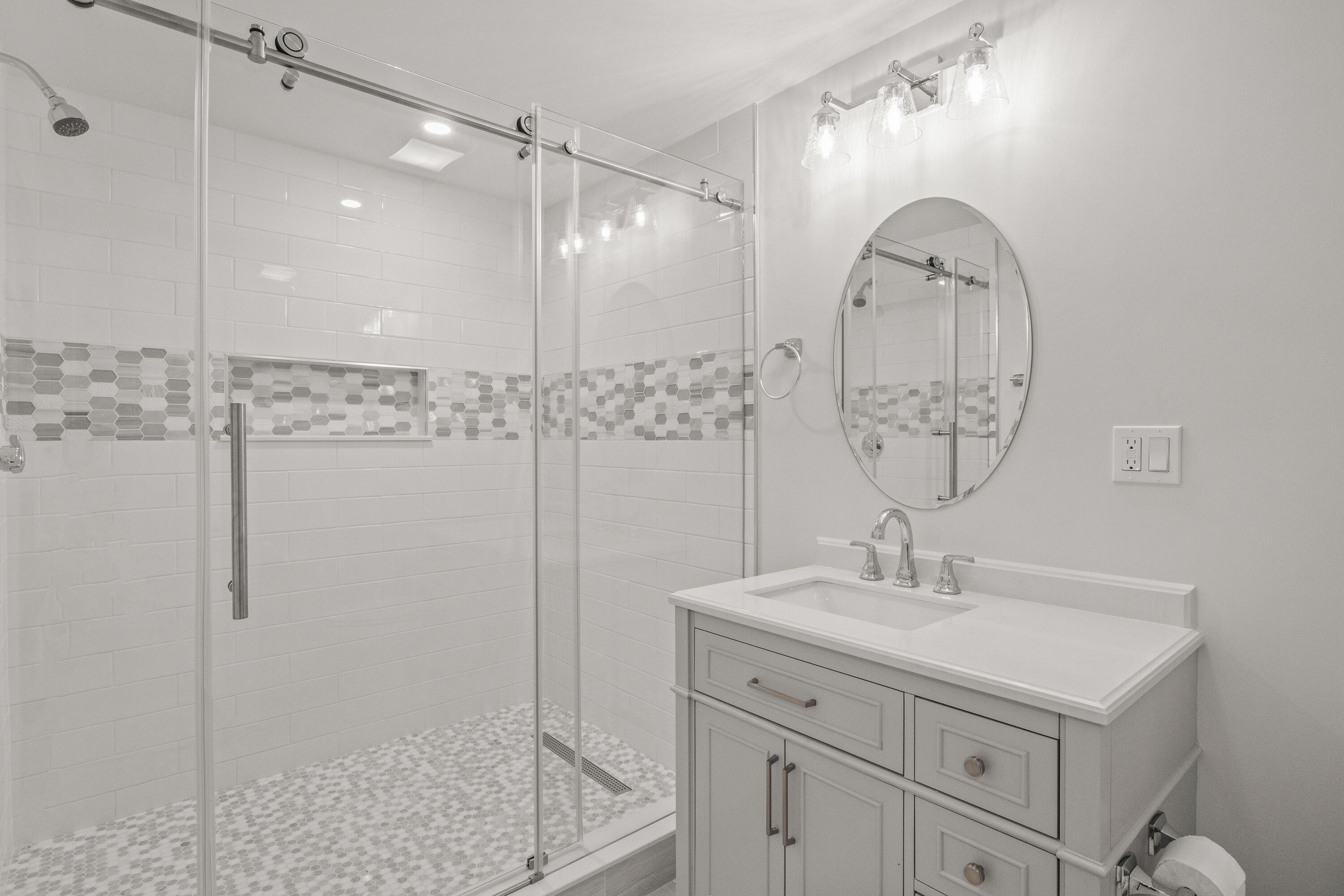 5 Locust Grove Road Harwich, MA 02645 - Photo 33 of 39 a bathroom with a sink a shower and a mirror