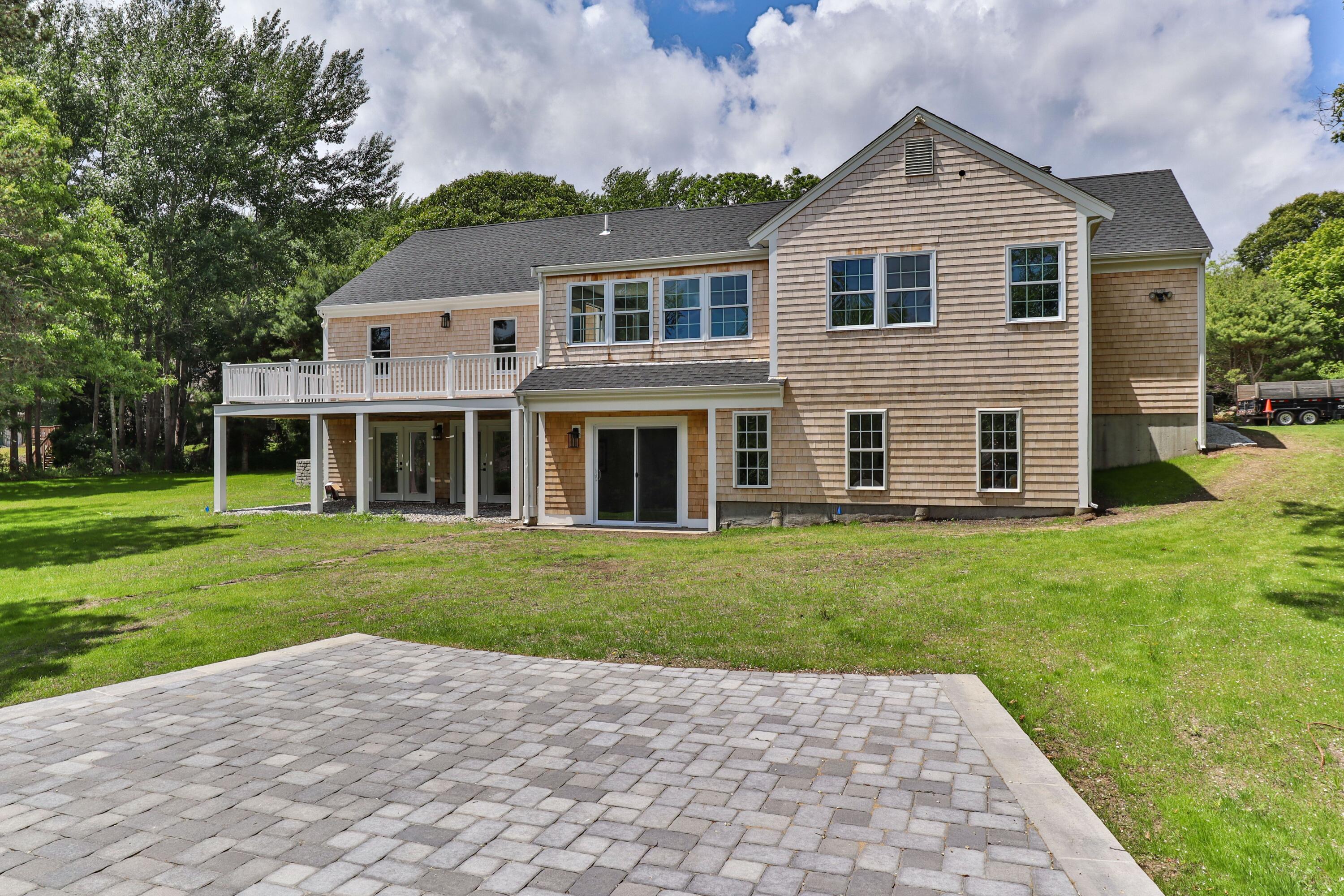5 Locust Grove Road Harwich, MA 02645 - Photo 4 of 39 front view of a house with a yard