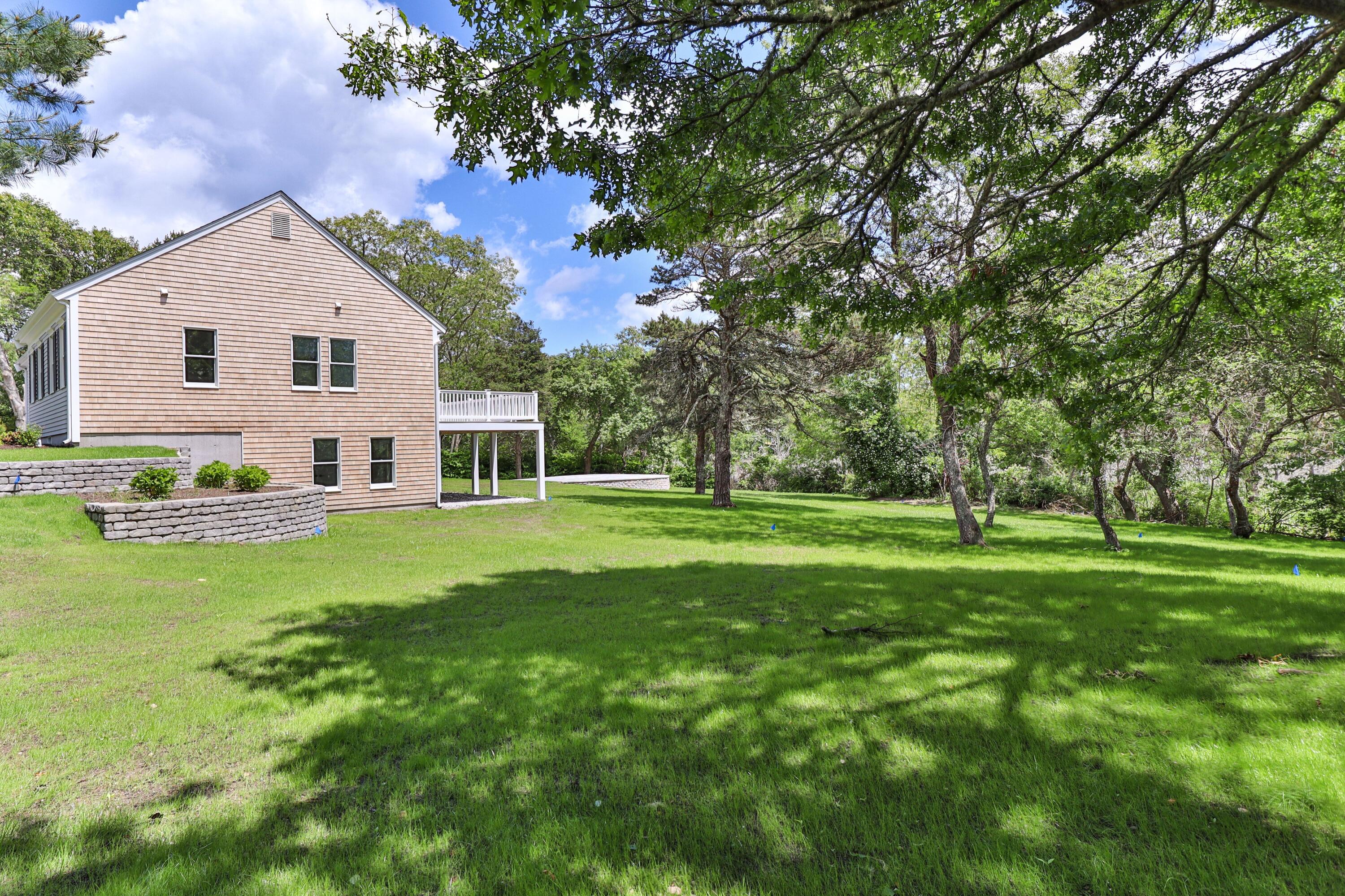 5 Locust Grove Road Harwich, MA 02645 - Photo 5 of 39 a view of a house with a yard