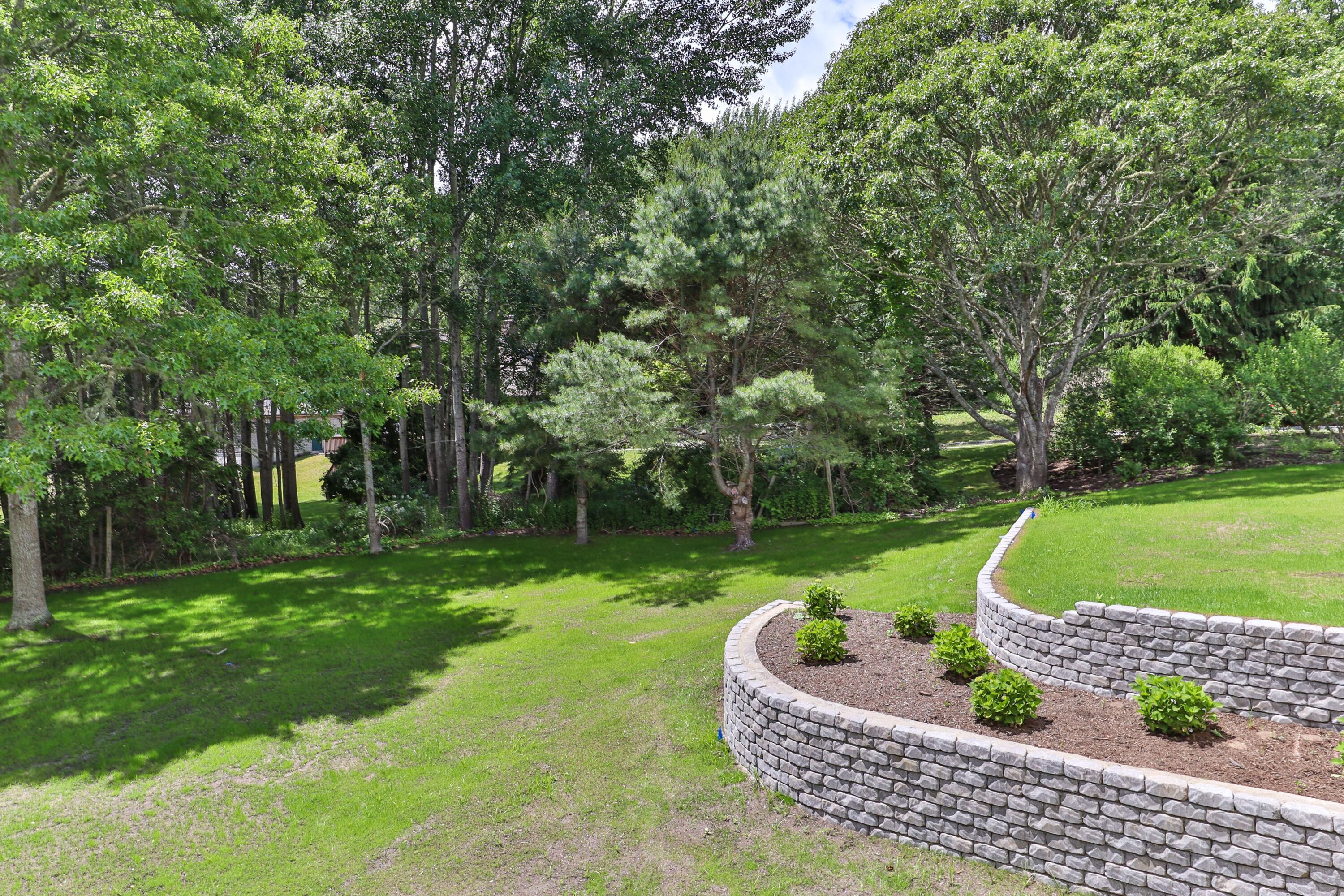 5 Locust Grove Road Harwich, MA 02645 - Photo 7 of 39 a garden view with a seating space